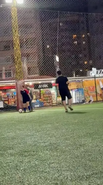 NCAS players on a floodlit pitch at night