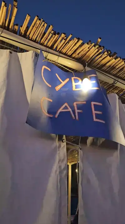 A hand-painted Cyber Cafe sign