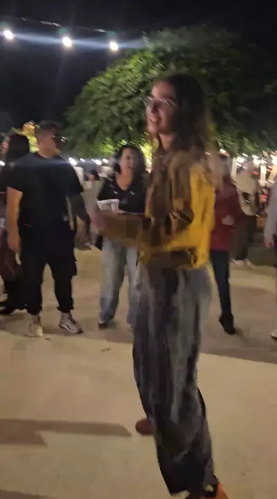 A guest dancing in the crowd at night