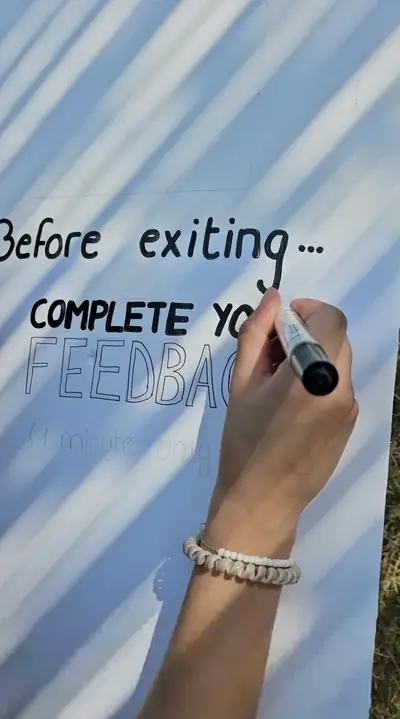 A hand writing Before exiting, complete your feedback on a board