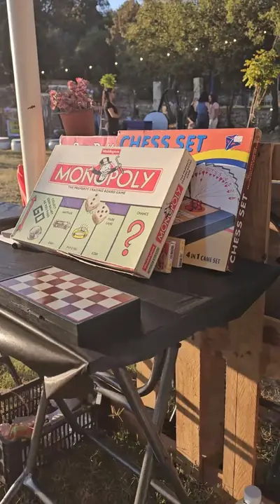 Monopoly and chess boxes on a shelf