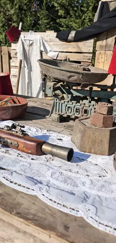 Old household objects laid out on lace