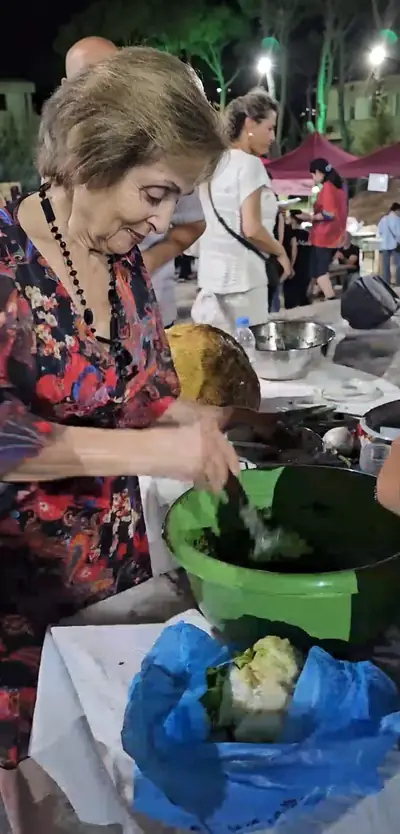 A woman preparing food the traditional way