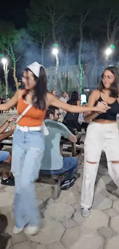 A line of guests dancing dabke
