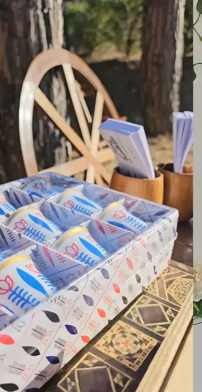 Boxes of old-fashioned sweets beside a wooden cart wheel