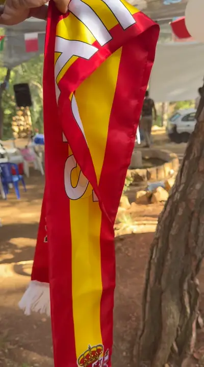 A Spain football scarf hanging on a tree